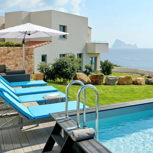 Duplex suites at 7Pines Resort Ibiza on The Cliff with modern Ibizan décor and panoramic sea views.
