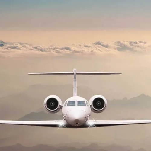 A plane in the sky showcasing the convenience and luxury of 7Pines Resort Ibiza's private jet service.